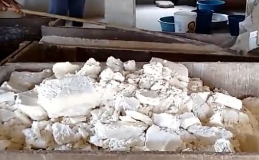 Caked, dried cassava pulp waiting to be milled for the production of cassava flour