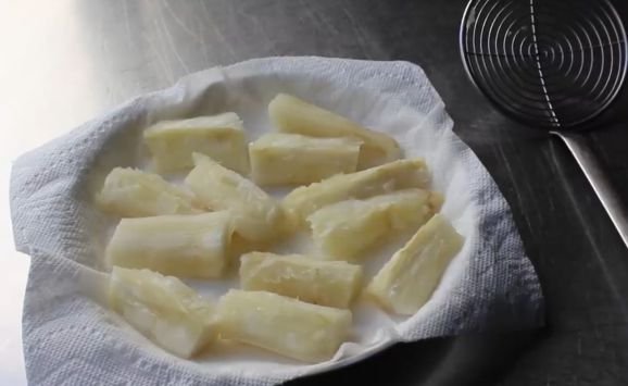 Cooked yuca just before being fried