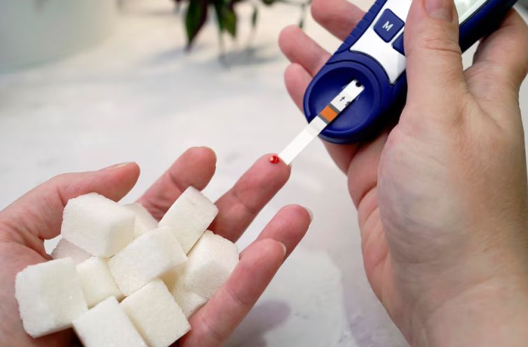 A diabetic checking blood sugar after consuming cassava