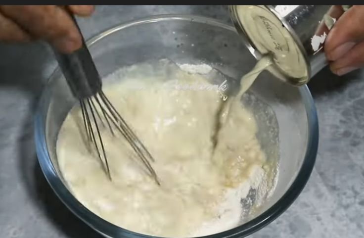 Milk being mixed into the batter