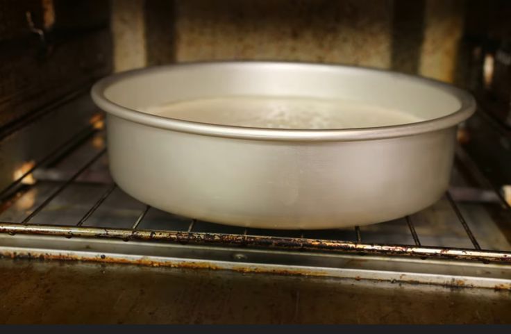 Pan containing the cassava pie in the oven