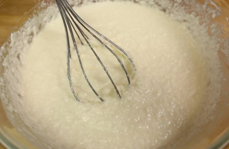 Preparing the mixture of grated cassava, coconut milk and other ingredients