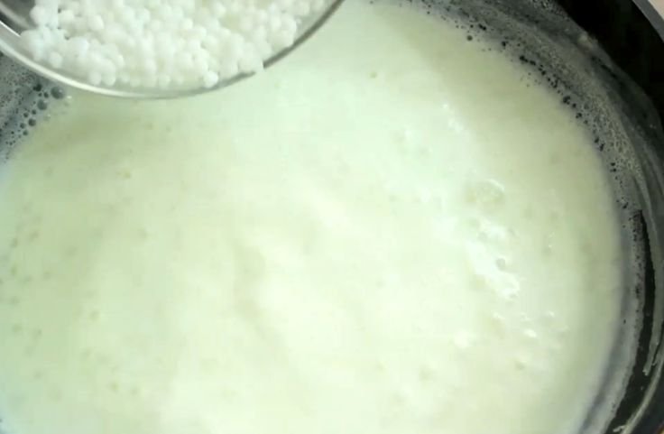 Soaked sabudana being added to the milk