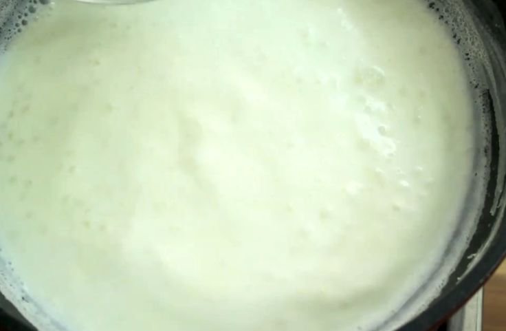 Milk for sabudana boiling on low heat