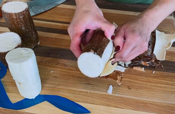 Peeling the yuca root for baked yuca fries 