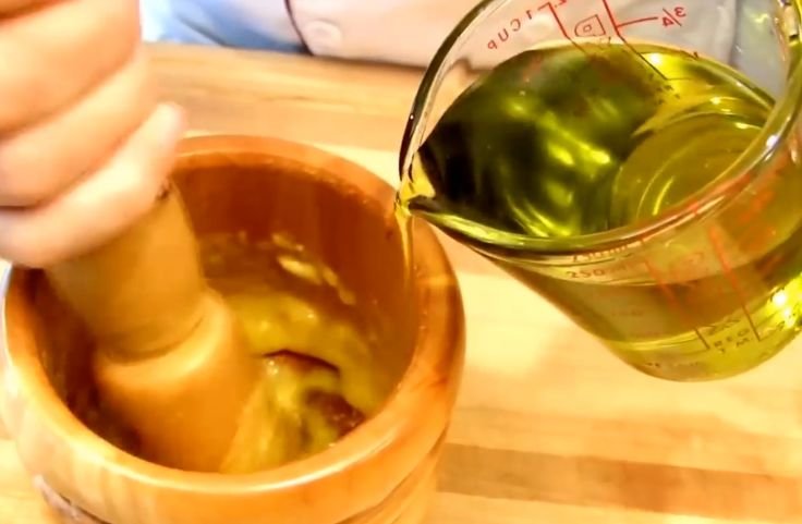 Adding olive oil to the paste