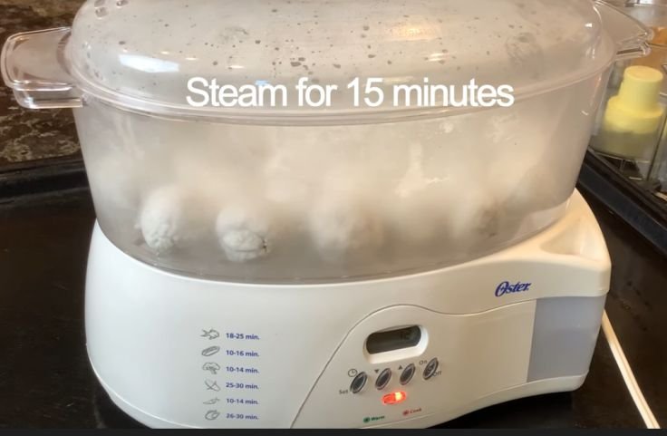 Steaming the dumplings for 15 minutes until translucent