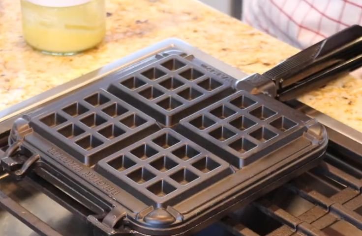 The waffle iron being preheated