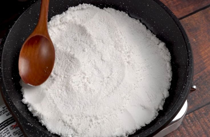 Spreading a thin layer of tapioca starch to cook