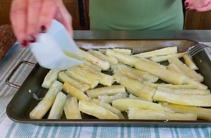 Cassava roots being seasoned for baking