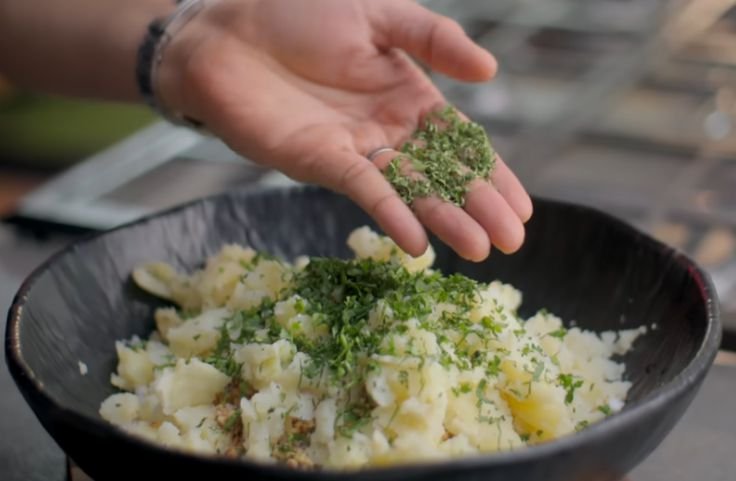 Adding spices into the sabudana vada dough