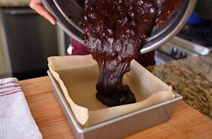 Transferring the well-mixed bater to a baking pan