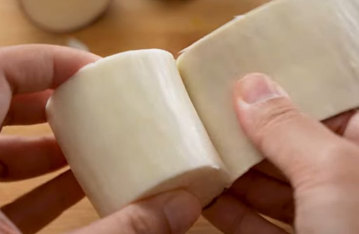 Peeling fresh cassava root
